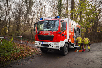 German fire engine truck during a mission in forest - 97891586
