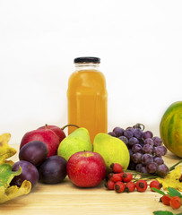 Glasses of tasty fresh juice, on wooden table.