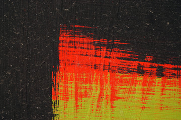 Brushstroke - black,  green and red acrylic paint  on  metal sur