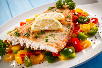 Fish dish - fried fish fillet and vegetables 