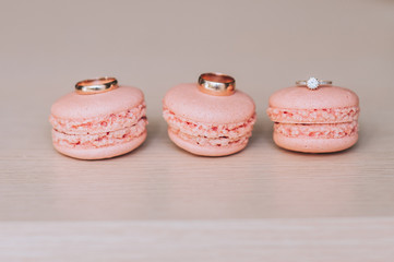 macarons with wedding rings close up shot, retro filter