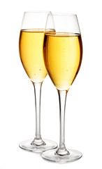 Two elegant champagne glasses close-up isolated on a white background. Festive still life.