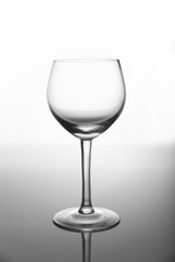 Empty wine glass on the dark background