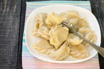 Dumplings with potato in rustic style, selective focus.