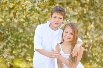 Obraz premium Portrait of a boy and girl in summer