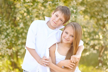 Fototapeta premium Portrait of a boy and girl in summer