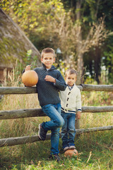 Boys having fun with pumpkins