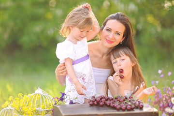 portrait of a happy family in the summer on the nature