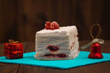 cake with fresh cherry on wooden background