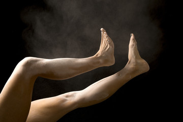 Fototapeta na wymiar woman's legs out toes up powder