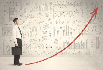 Business man climbing on red graph arrow concept