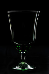 Empty glass on black background