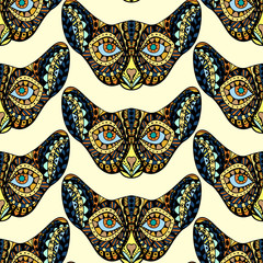 Seamless pattern with hand drawn ornate doodle graphic monochrome cat faces.