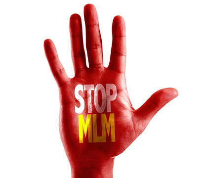 Stop MLM (Multi Level Marketing) written on hand isolated on white background