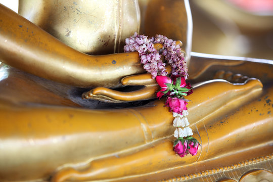 garland on buddha statue