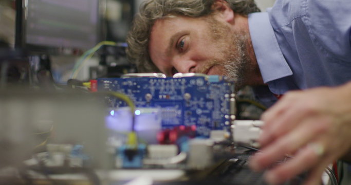 Workers building computers in a British electronics factory