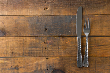 fork and knife on wood