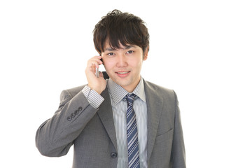 通話中の笑顔のビジネスマン