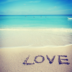 Love inscribed in the sand of a beach