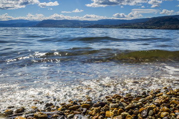 Closeup of Waves Rolling into Beach Shoreline