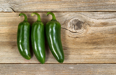 Mature hot peppers on rustic wood