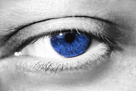 Image of man's blue eye close up.