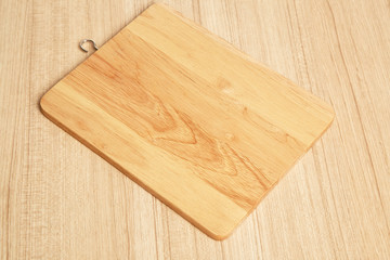Empty cutting board on planks food background concept