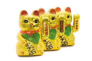 Row of Maneki neko lucky asian waving cat