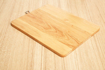 Empty cutting board on planks food background concept