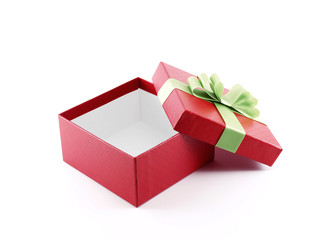 closeup open and empty gift box wrapped in red color paper with grid pattern with lime green ribbon and folded bow isolated on white background, surprise in holiday festive