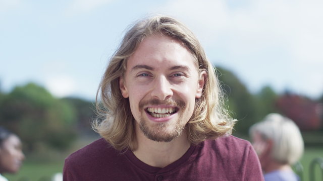  Happy young man having a video chat, as seen from the computer screen's point of view
