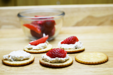 spread tuna and strawberry on biscuit 