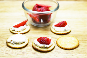 spread tuna and strawberry on biscuit 