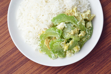 Stir fried bitter gourd with egg on rice