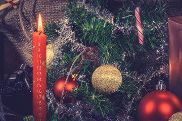 Red Christmas candle with a calendar