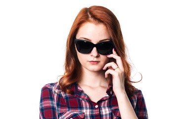 Fototapeta premium Close-up portrait of a pensive girl with dark glasses