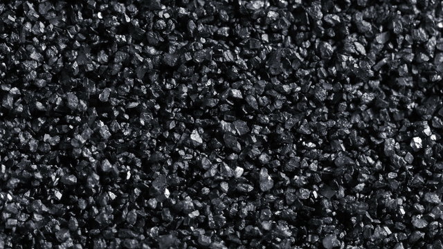 Black sand grunge background. Сlose-up 4K UHD 2160p footage.
