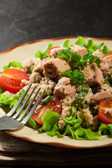 Tasty salad with couscous, tuna and vegetables
