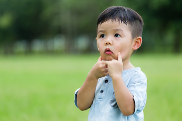 Little boy with hand touch on his face