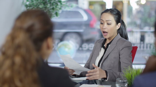 Conflict in a business meeting - Lady boss gives the rest of her team a stern talking to. 