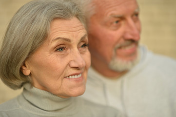 Mature couple near wall