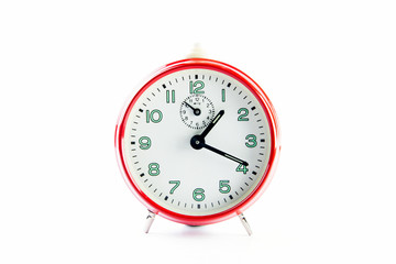 Red alarm clock on the white background.