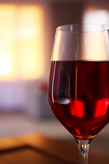 Glass of red wine on blurred background