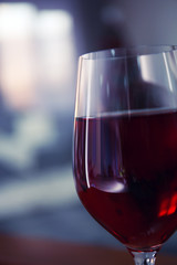 Glass of red wine on blurred background