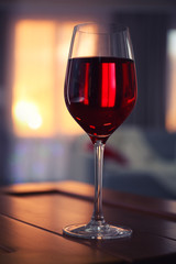 Glass of red wine on blurred background