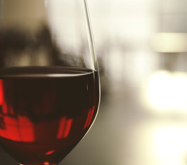 Glass of red wine on blurred background