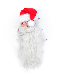 Santa Claus looking through hole in a white wall