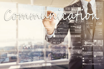 the businessman in the office is writing on the transparent board Communication