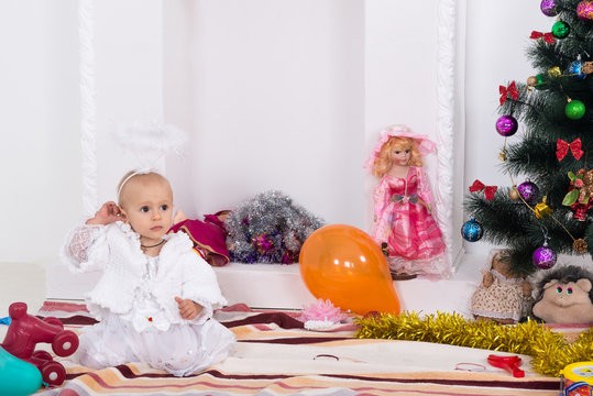 Little girl near the Christmas tree