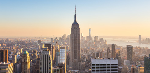 New York City Manhattan skyline in sunset. - obrazy, fototapety, plakaty